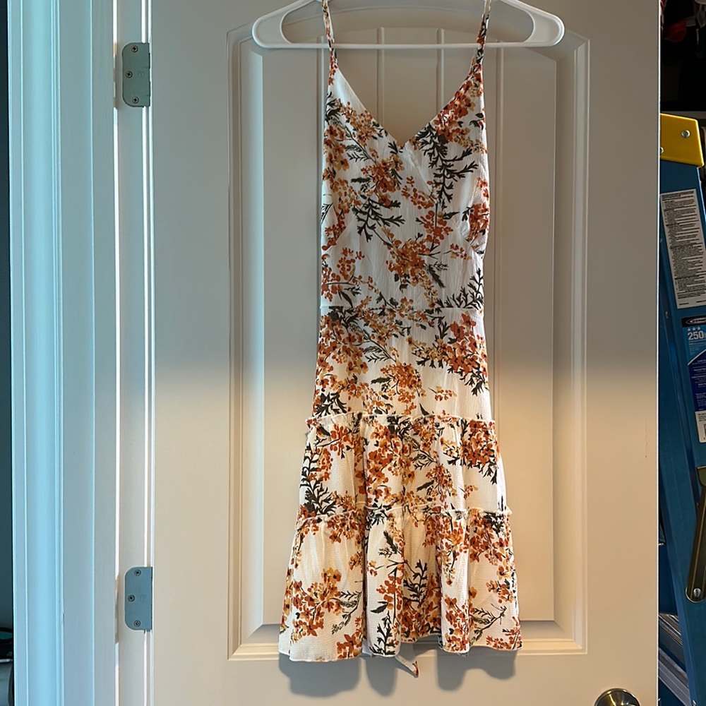Floral Summer Dress with adjustable straps and ties in back.